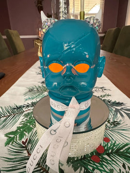 Teal Devil Wears Designer